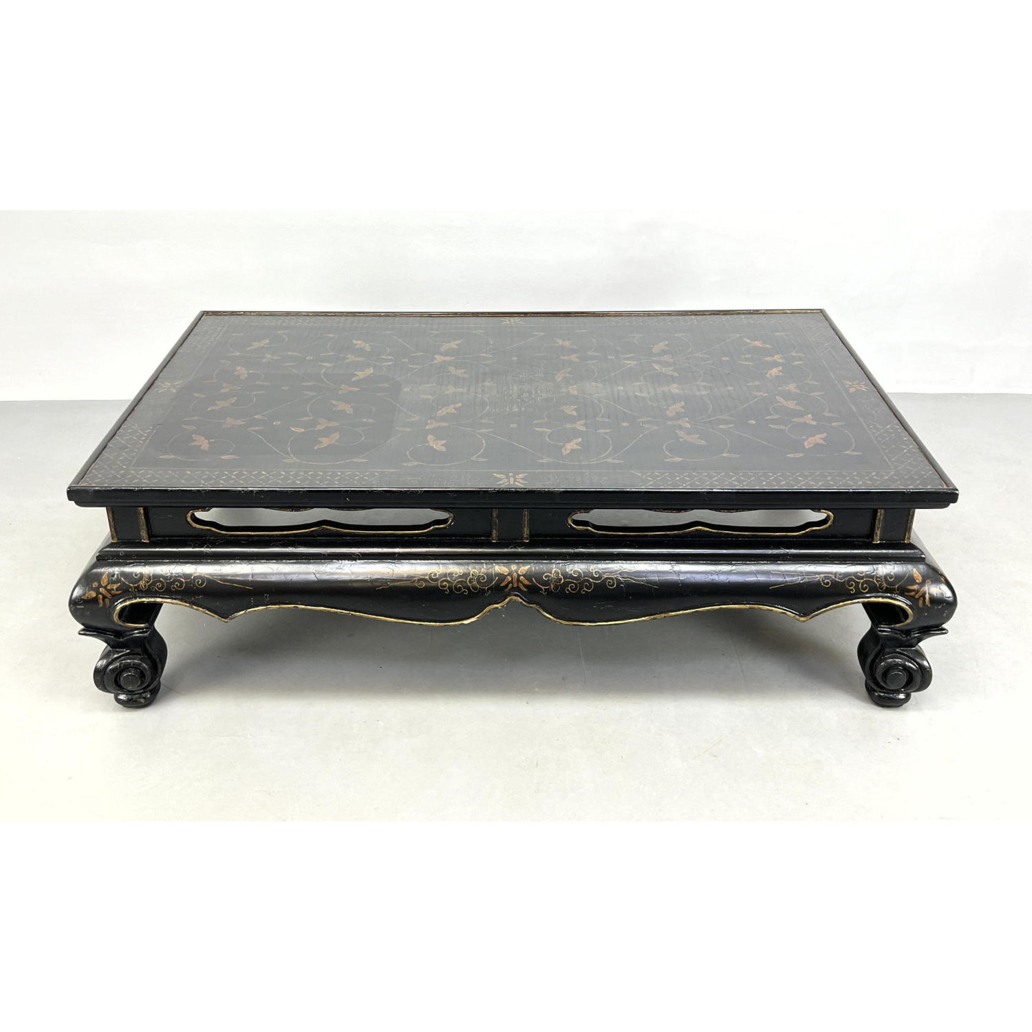 Appraisal: Ebonized Asian style Coffee Table Decorative Carved Skirt with gilt