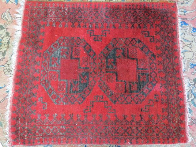 Appraisal: Belouchi Handmade Rug indigo geometrics on red ' X '