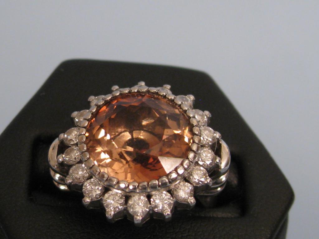 Appraisal: A Contemporary Bronze Topaz and Diamond Ring the large circular-cut