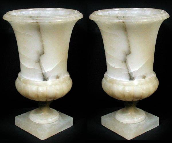 Appraisal: A pair of alabaster campana form urns height in