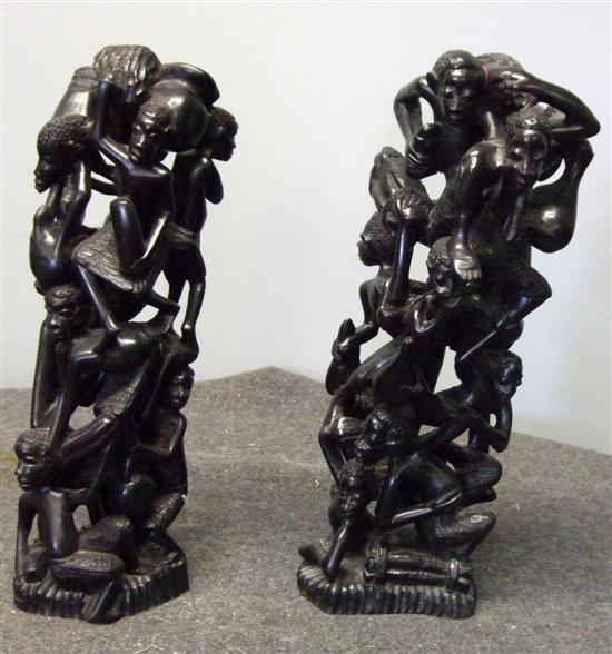 Appraisal: Pair of African ebony carved figural groups h in