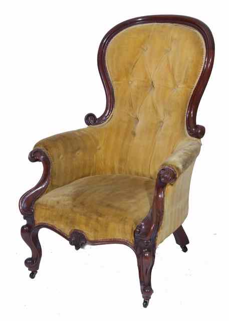 Appraisal: A VICTORIAN MAHOGANY SPOON BACK GOLD DRALON BUTTON UPHOLSTERED ARMCHAIR