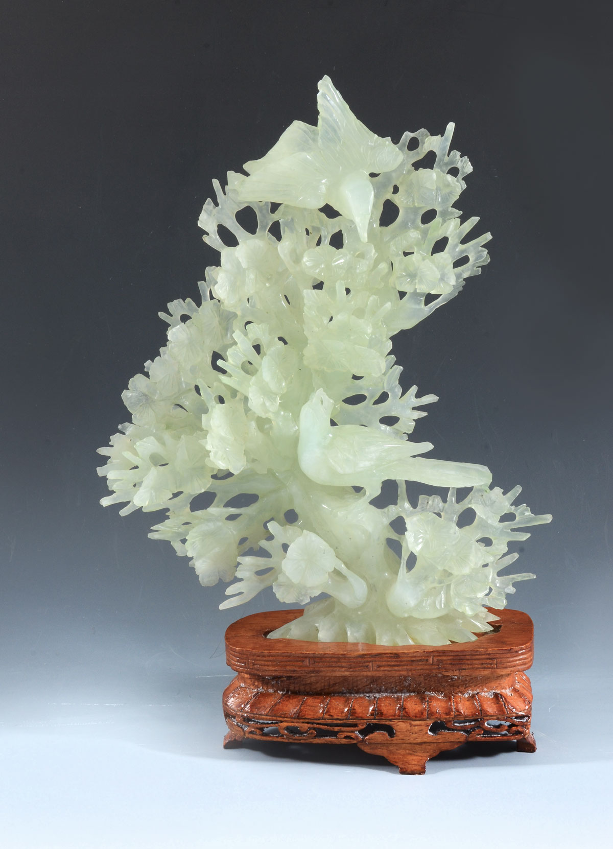 Appraisal: JADE BIRD SCULPTURE ON STAND Carved pierced Chinese Celadon jade