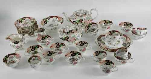 Appraisal: A Staffordshire porcelain part tea service printed and enamelled in