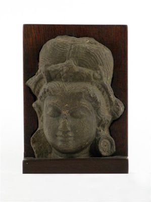 Appraisal: A Gupta grey-green schist carving of the head of a