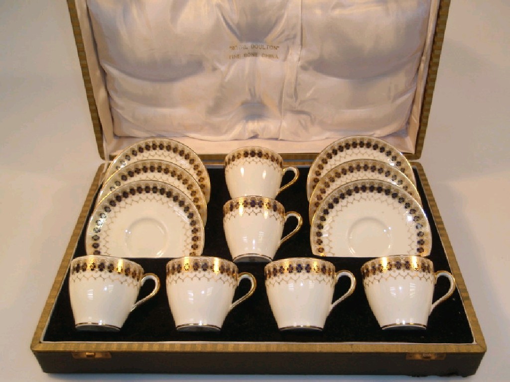 Appraisal: A Royal Doulton coffee service decorated with royal blue and