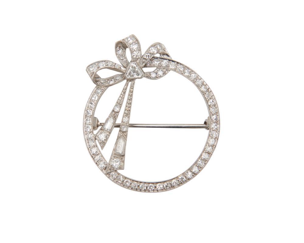 Appraisal: Platinum and Diamond Brooch the circle and bow form brooch