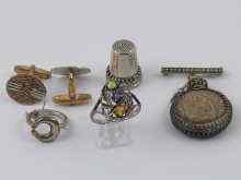 Appraisal: A mixed lot comprising two silver rings a silver thimble