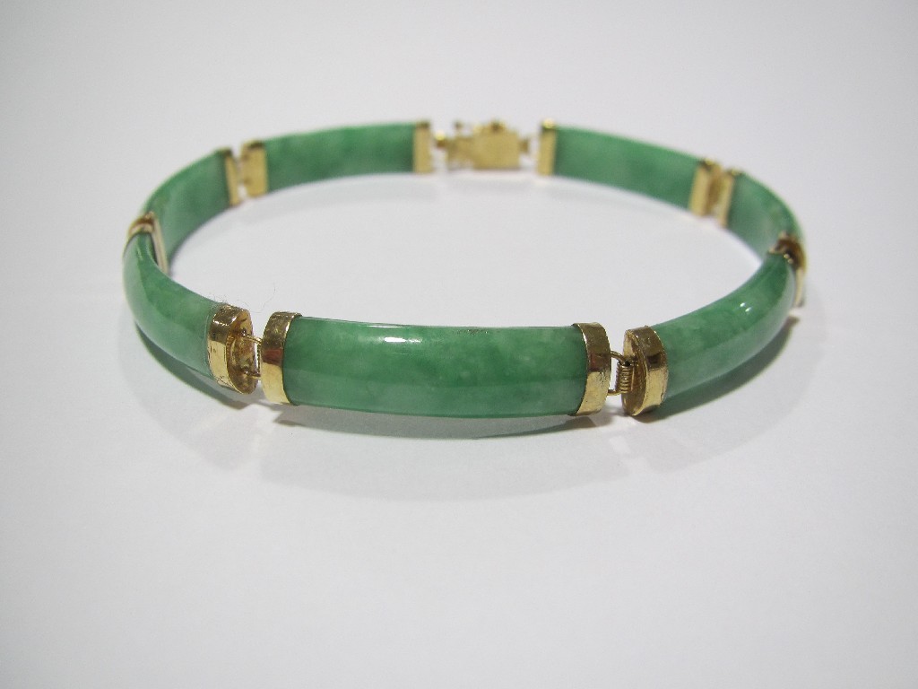 Appraisal: Chinese jade bracelet with elongated sections mounted in fourteen carat