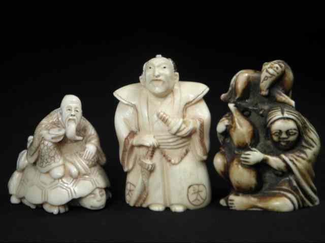 Appraisal: Japanese ivory netsuke group Includes carved ivory samurai carved ivory