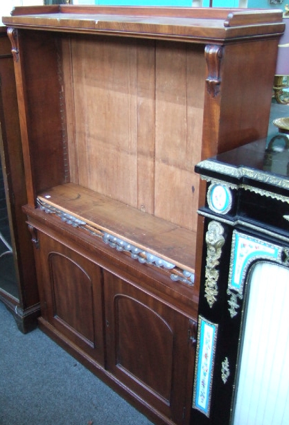 Appraisal: A Victorian mahogany floor standing open bookcase cupboard the three