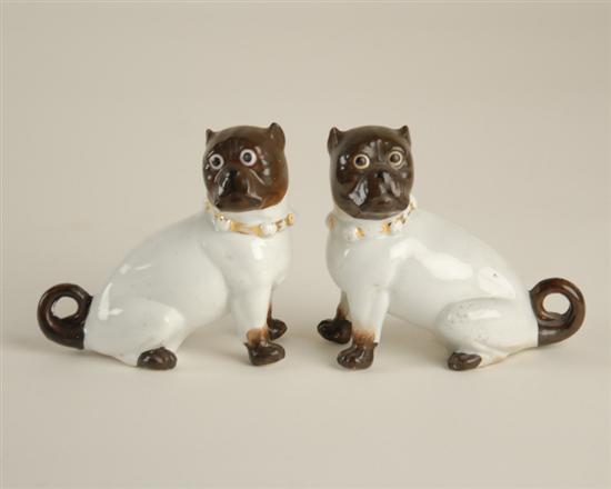 Appraisal: A Pair of Porcelain Pug Figures painted and gilt trimmed