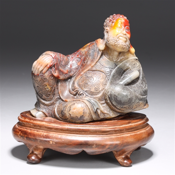 Appraisal: Fine Chinese carving of a figure reclined with very detailed