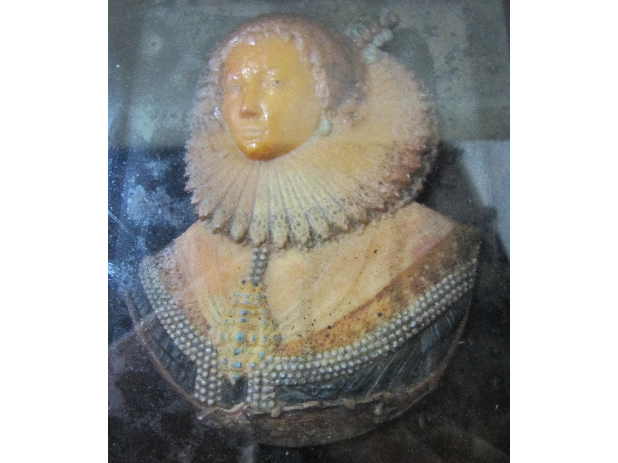 Appraisal: A framed wax head and shoulders portrait of an Elizabethan