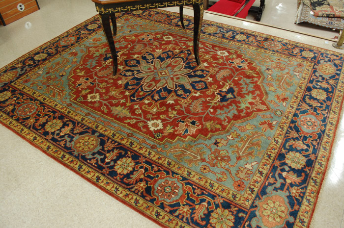 Appraisal: HAND KNOTTED ORIENTAL CARPET Persian Serapi design stylized floral and