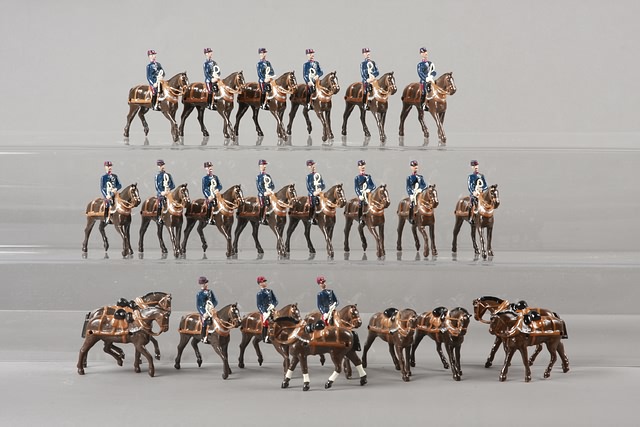 Appraisal: Lot of metal horses with figures for pulling wagons and