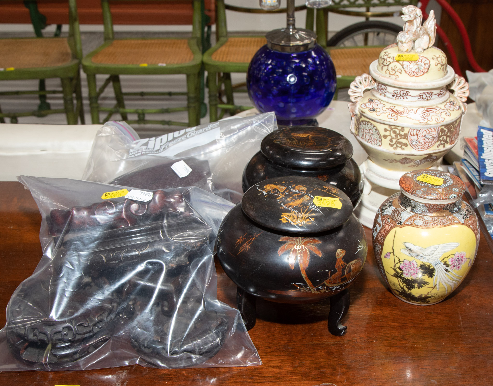 Appraisal: SELECTION OF ASIAN DECORATIONS STANDS Including a Satsuma covered urn