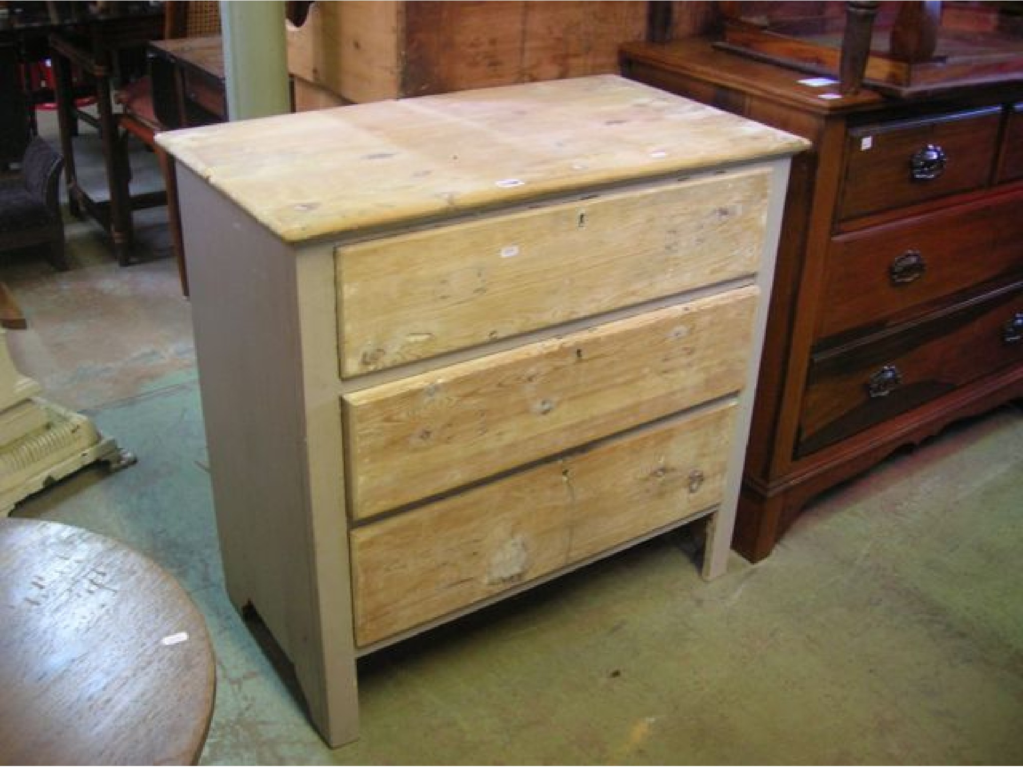 Appraisal: A small partially stripped pine bedroom chest of three long