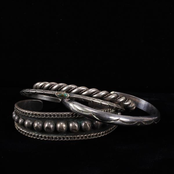 Appraisal: Four Native American sterling silver cuff bracelets inner width