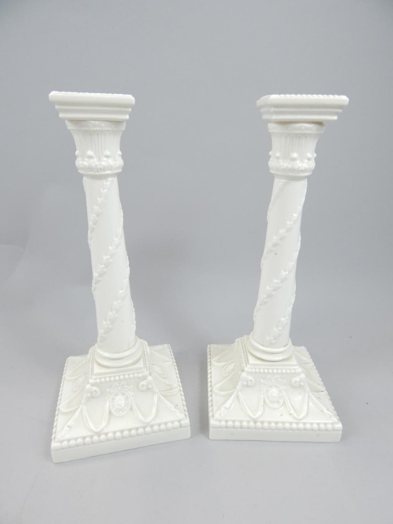 Appraisal: A pair of early thC Royal Worcester candlesticks of Corinthian