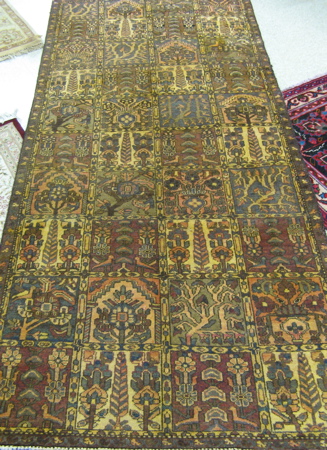 Appraisal: PERSIAN BAKHTIARI PANEL RUG featuring flower-filled panels arranged in columns