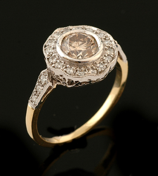 Appraisal: A diamond flower cluster plaque ring Centrally set with a