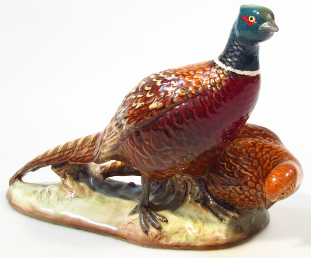 Appraisal: A large Beswick model of a cock and hen pheasant