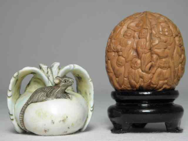 Appraisal: Two Japanese carved Katabori Netsuke Includes a carved Walnut Kurumi