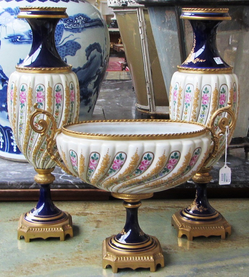 Appraisal: A modern porcelain two handled bowl with gilt brass mounts