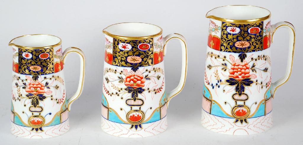 Appraisal: GRADUATED SET OF THREE VICTORIAN COPELAND IMARI CHINA JUGS tapering