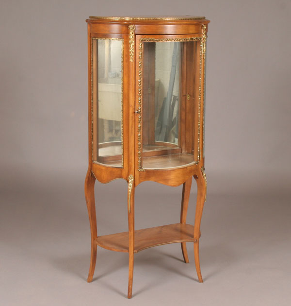 Appraisal: French style curved glass front curio cabinet shaped leg embossed