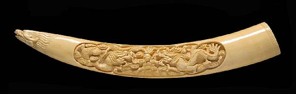 Appraisal: A tinted ivory tusk with carved decoration th Century Its