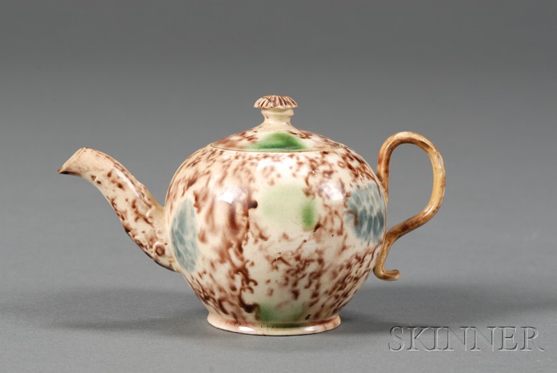 Appraisal: Staffordshire Tortoiseshell Glazed Creamware Teapot and Cover England c globular