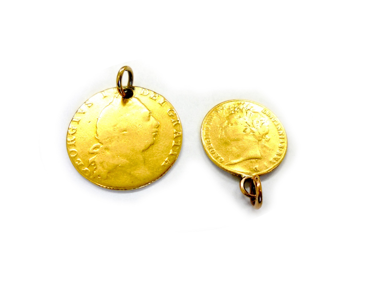 Appraisal: A George III 'spade' guinea pierced and mounted as a