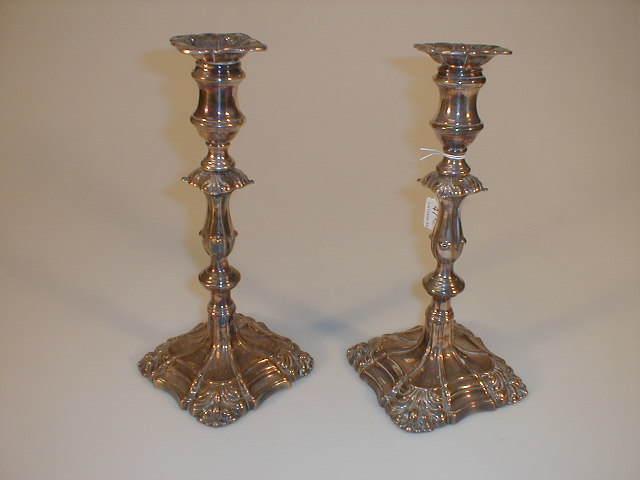 Appraisal: A pair of silver plated table candlesticks each with removable