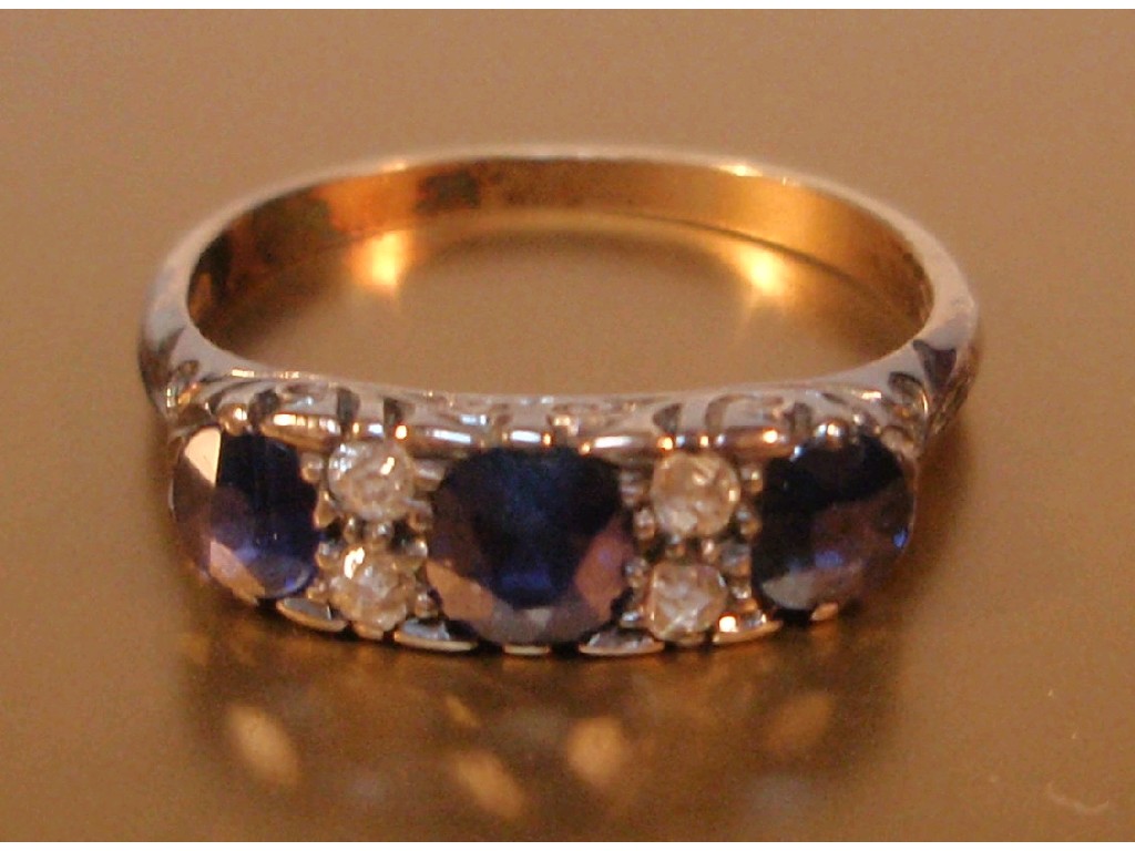 Appraisal: A ladies dress ring of three blue stones interset with