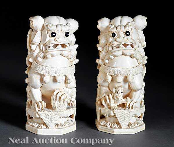 Appraisal: A Pair of Chinese Ivory Buddhist Lions each carved seated