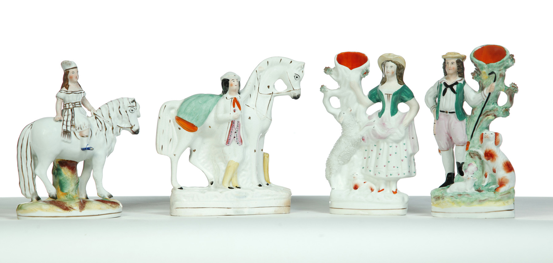 Appraisal: FOUR STAFFORDSHIRE FIGURES England rd quarter- th century Girl on