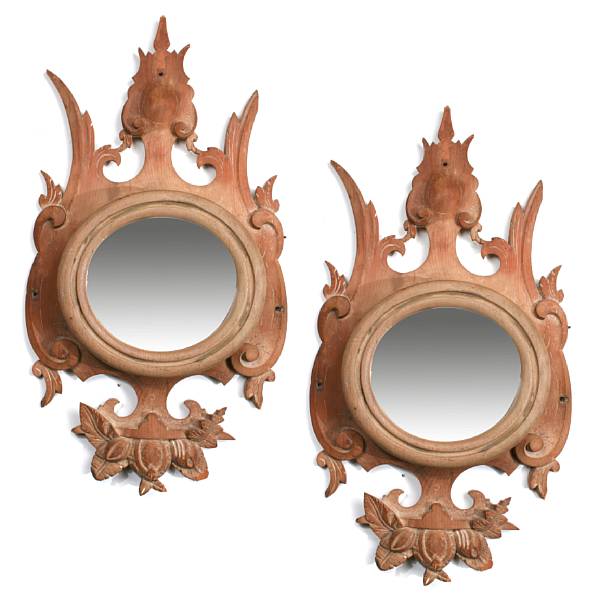 Appraisal: A pair of carved wood framed mirrors with convex glass