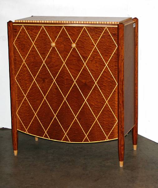 Appraisal: An Art Deco style faux ivory inlaid cabinet height in