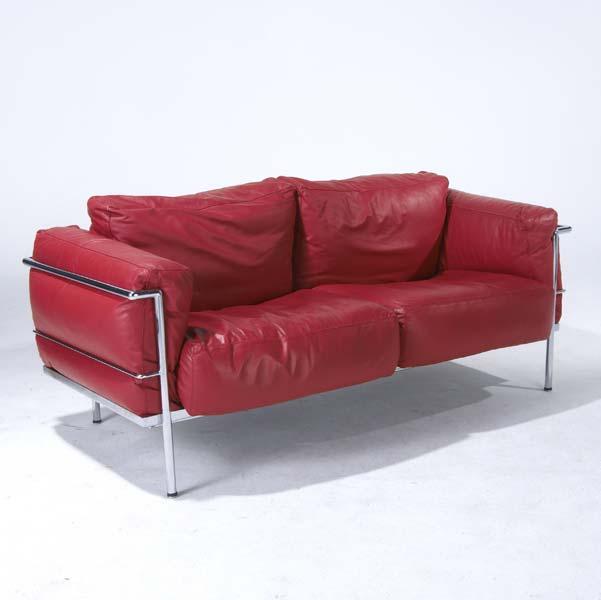 Appraisal: LE CORBUSIER Settee on polished chrome frame its cushions upholstered