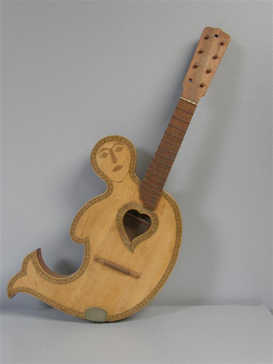 Appraisal: Unusual th century guitar in the form of a mermaid