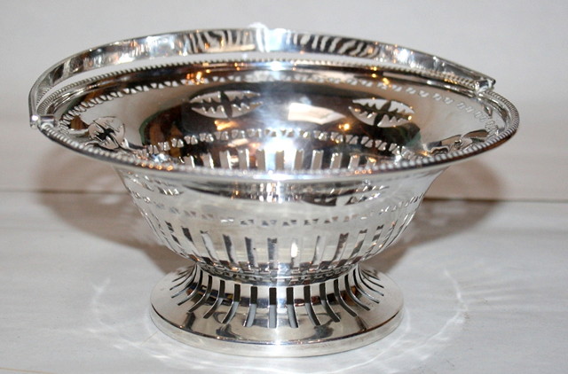 Appraisal: AN EDWARDIAN SILVER CAKE BASKET with pierced circular bowl beaded