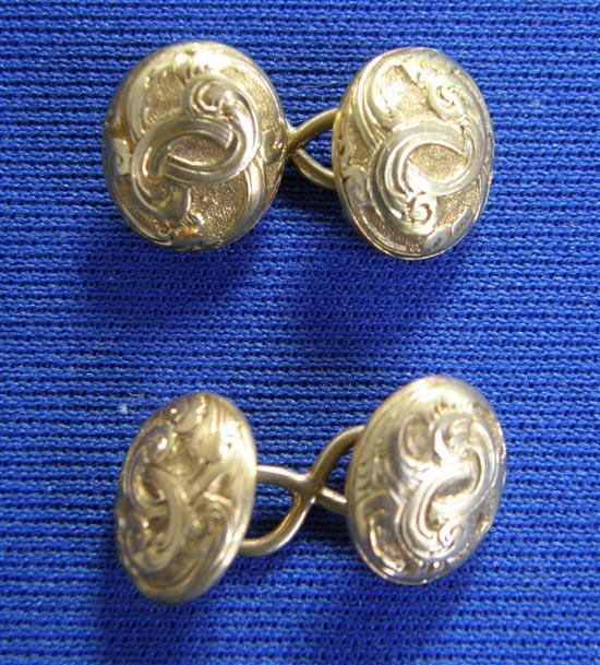 Appraisal: Oval decorated gold cuff links