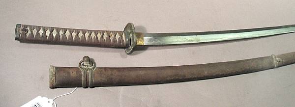 Appraisal: A composite Japanese shin-gunto officer's sword The inch unsigned blade