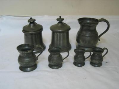 Appraisal: TWO SIMILAR PEWTER TOBACCO JARS of cylindrical form with turned