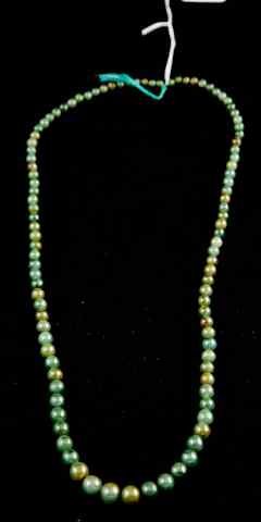 Appraisal: CHINESE DARK GREEN AND RUSSET GRADUATED STRAND OF BEADS the