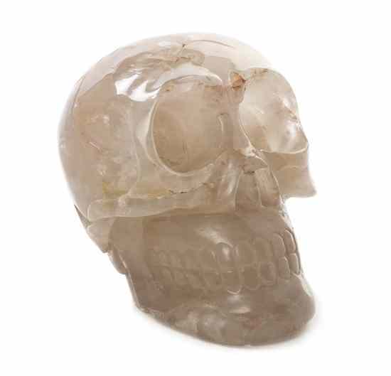 Appraisal: A Carved Quartz Skull of typical form having natural inclusions