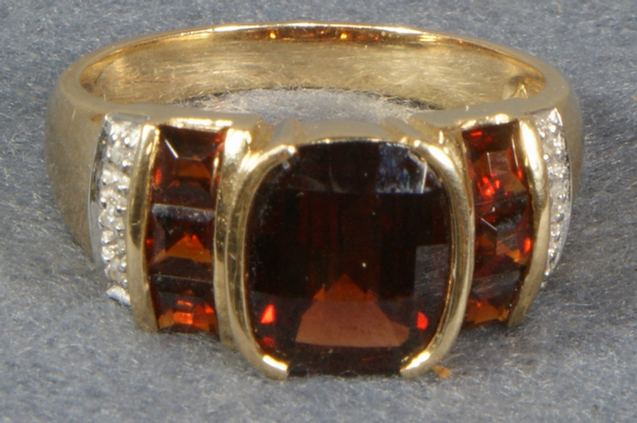 Appraisal: Unmarked YG mans garnet ring size dwt Estimate -