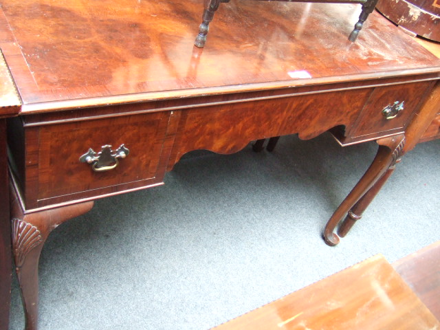 Appraisal: A mid th century burr walnut kneehole dressing table the